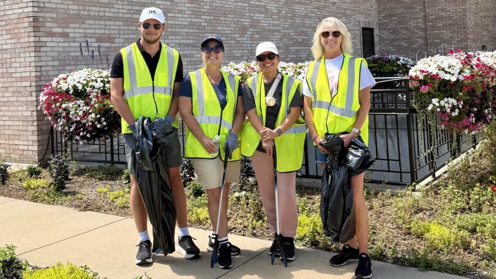 BOS employees volunteer for a clean-up day in Springfield, IL with Adop-A-Highway.